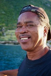 A happy, smiling Jamaican man, Preston, out fishing with us in Treasure Beach, Jamaica.