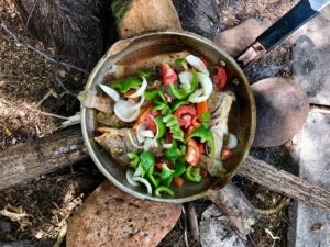 A delishious healthy meal of fish and veggies, cooked over an open fire, Jamaican style. 