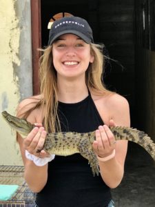 Holding a crocodile at Black River Safari, Jamaica